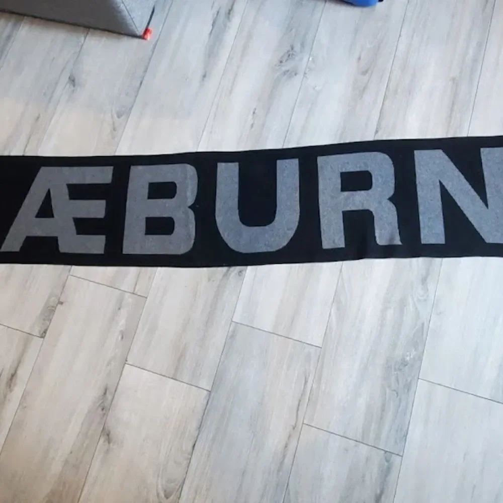 Positively Conscious Raeburn Knitted black cashmere blend Logo Scarf